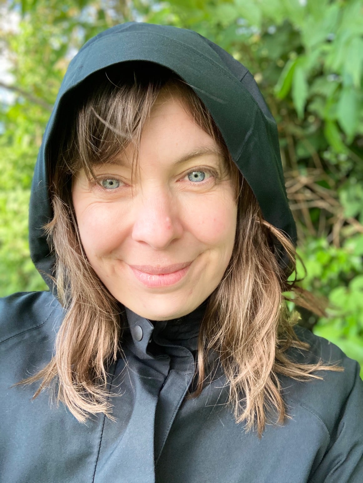 Kelley wearing a rain coat